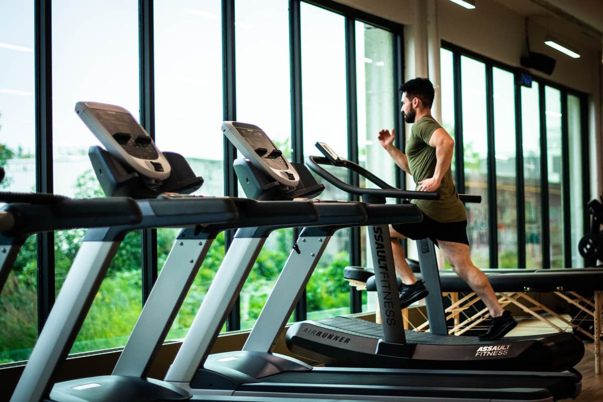 Cardio floor of a modern athletic club with floor-to-ceiling windows